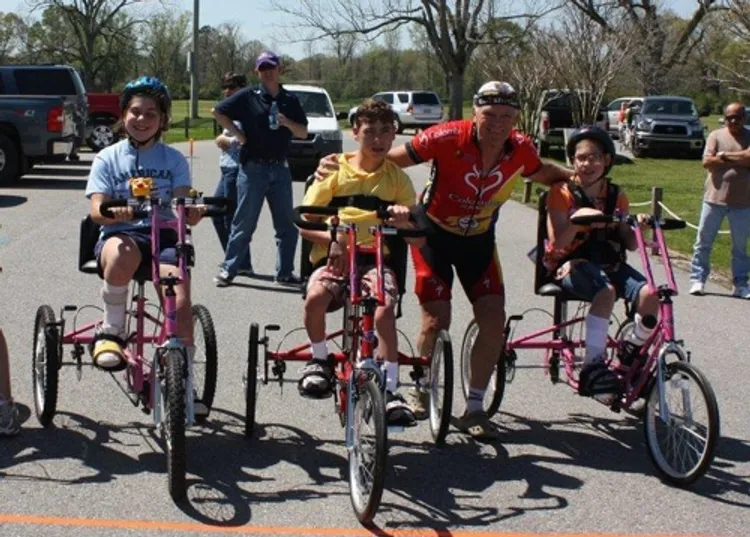 Jairo Alvarez rides bikes with children with special needs