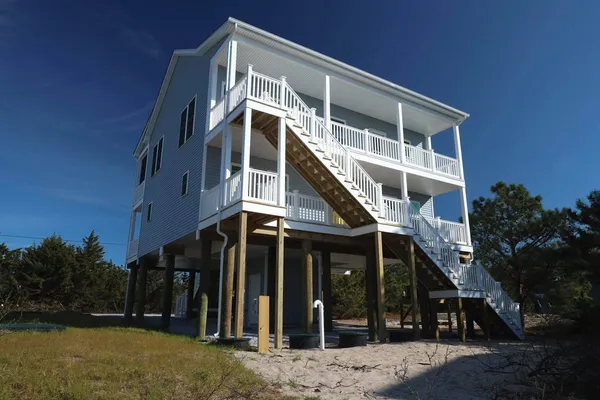 This tall 2 Story Beracah just outside of Broadkill Beach, Delaware overlooks the Bay on the front and Prime Hook off this deck.