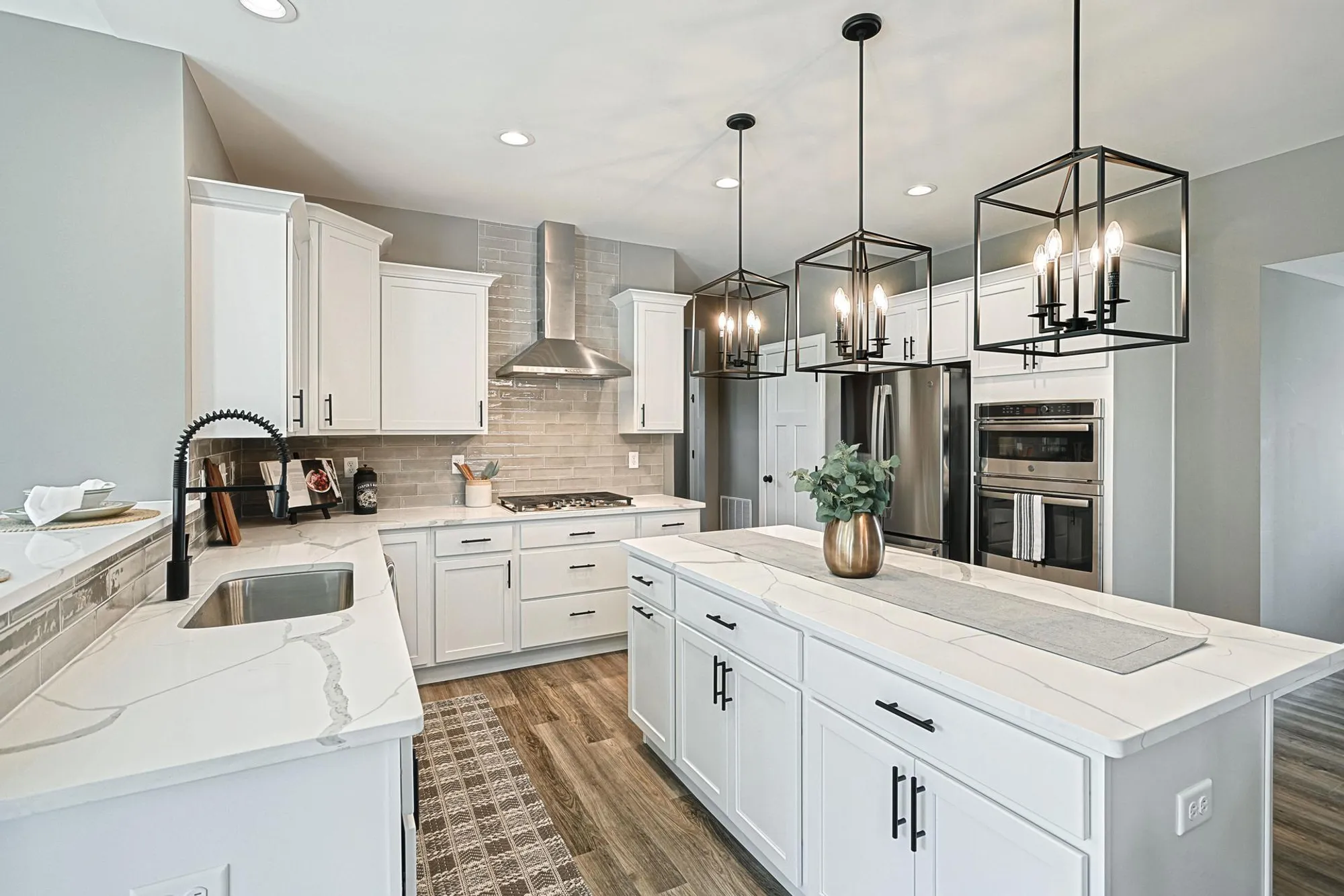 Kitchen with white cabinets and center island from Berks homes