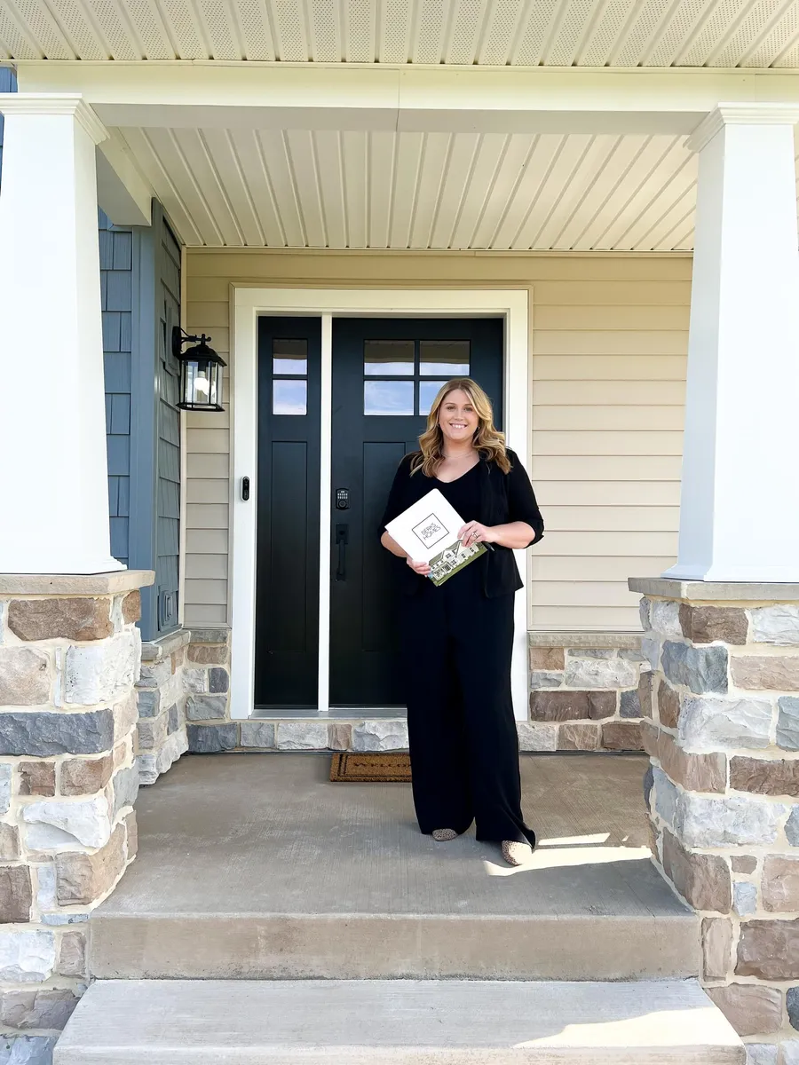 Woman standing in front of a new berks home