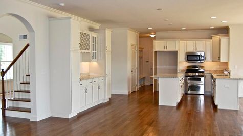 White Kitchen with Oak Hardwood Flooring