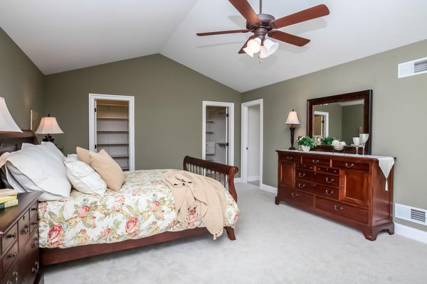 Beautiful Master Bedroom with Walk-In Closets and Cathedral Ceiling