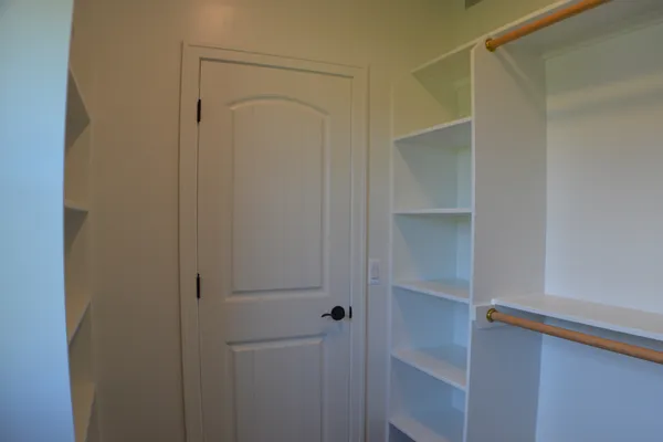 Master suite walk in closet with built in storage