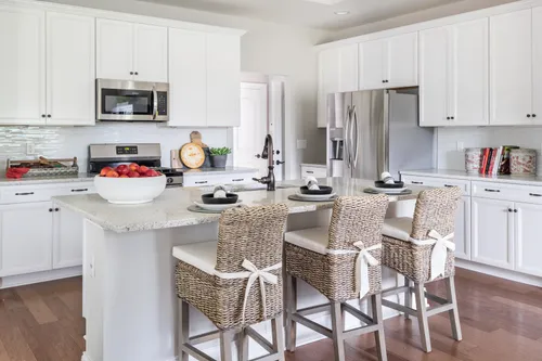 model home kitchen white cabinets hardwood paired home