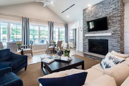 Ashlake Clubhouse interior great room seating fireplace lighting 55+ living Cornerstone Homes