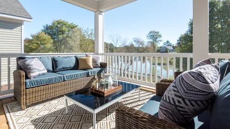 Screen porch overlooking Magnolia Lake by Cornerstone Homes