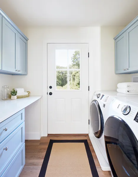 Spacious laundry room with storage.