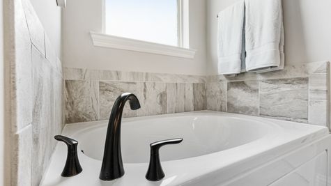 Master Bathroom  Master Bedroom- garden tub- granite countertops- tile- white cabinets-open floorplan- natural light- carpet- DSLD Homes- Baton Rouge area - Addis- Louisiana- Sugar Mill Plantation