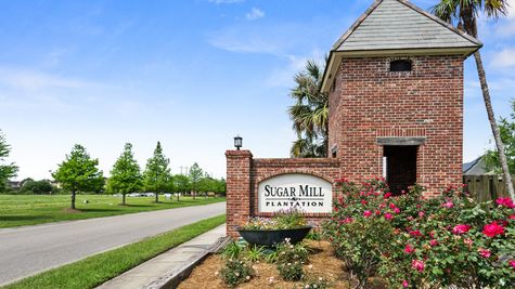 front entrance sign of new construction homes in addis, la in sugar mill plantation