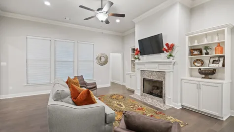 Living Room with Decor and Fireplace - The Settlement at Live Oak - DSLD Homes Thibodaux