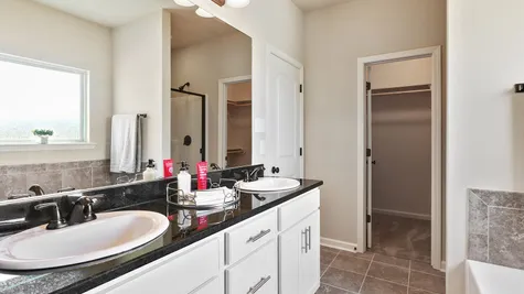 Natural Light- cream- white cabinets- dark granite- Master Bathroom- Open Floor Plan- Model Home- Silver Hill- Community- Ponchatoula Louisiana- Hammond area- DSLD Homes