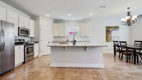 DSLD Homes - Camellia IV A Open Floor Plan - White Cabinets Kitchen Image