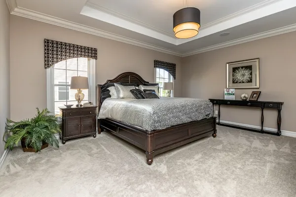 bedroom in a new home in essex greens at waterford community