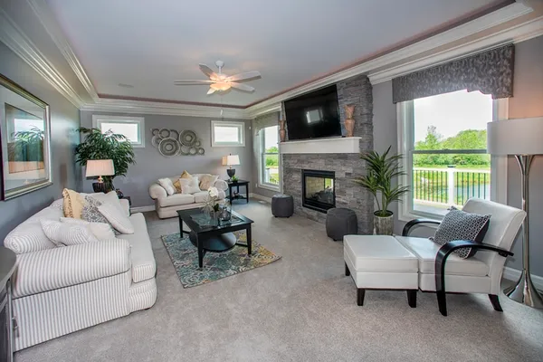 living room in a new home community, knoche farm estates, by essex homes of wny
