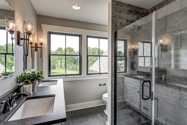 remodeled bathroom with large glass door shower from Garman Builders