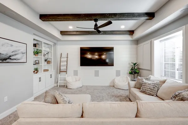 Remodeled living area with a tray ceiling from Garman Builders