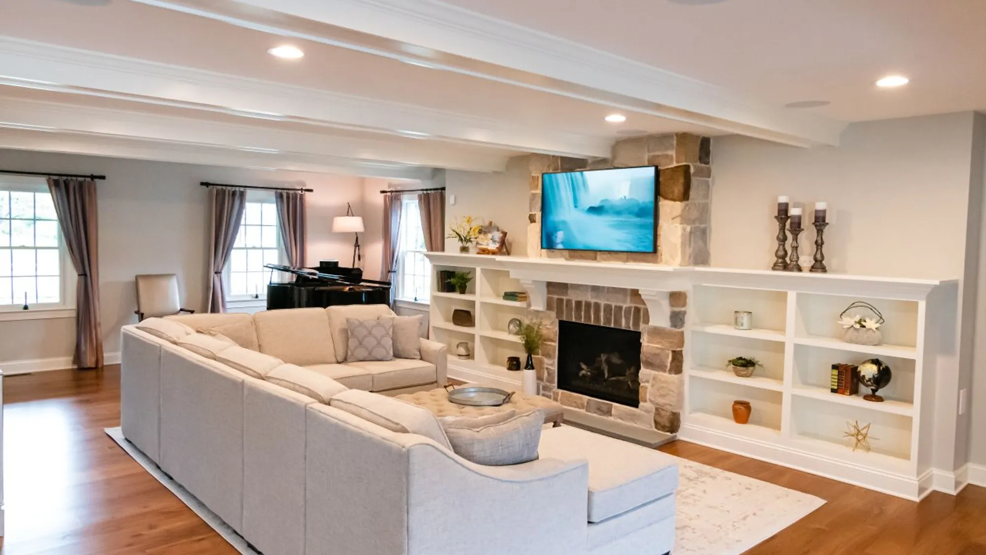 Remodeled Living room with stone fireplace from Garman Builders