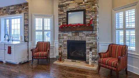 Fireplace with stone in a remodeled home from Garman builders