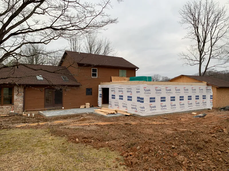 Exterior view of a home addition under construction