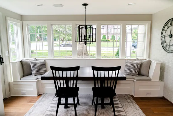 Dining room with a bench and two chairs in a Garman Homes Remodel