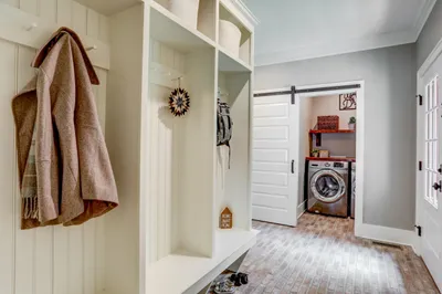 Mudroom with laundry room attached in a garman builders renovation
