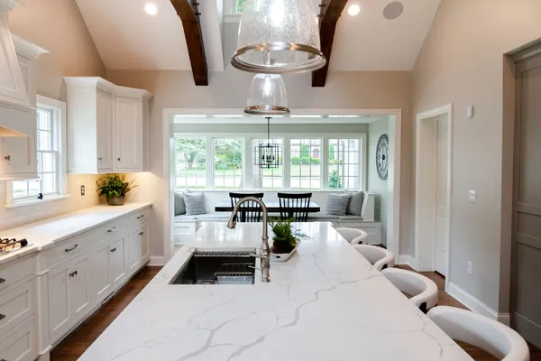 Kitchen with white cabinets and a center island in a Garman Homes Remodel