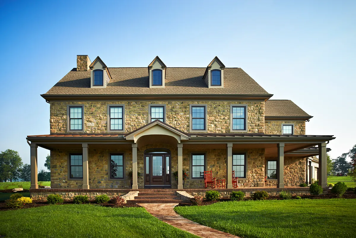Front elevation of a stone luxury home from Garman Builders