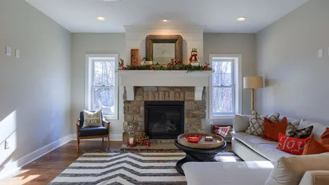 Living room with stone fireplace in a home renovated by garman builders