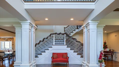 staircase with two ways to go up in a remodeled home from Garman builders