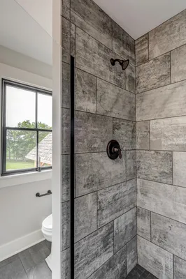 remodeled bathroom with large glass door shower from Garman Builders
