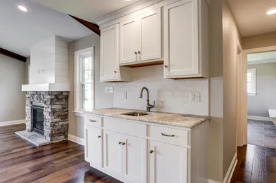 Kitchen with white cabinets and sink