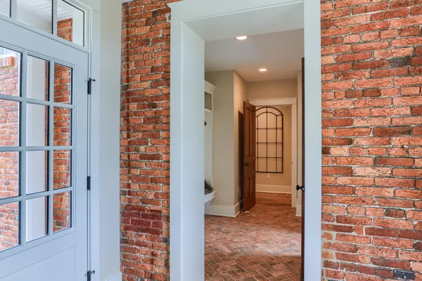Brick wall on the covered patio of a Garman Builders remodel