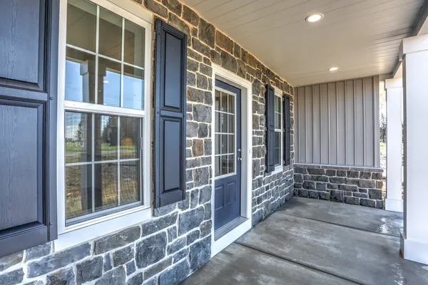 Front entrance of a stone home from Garman Builders