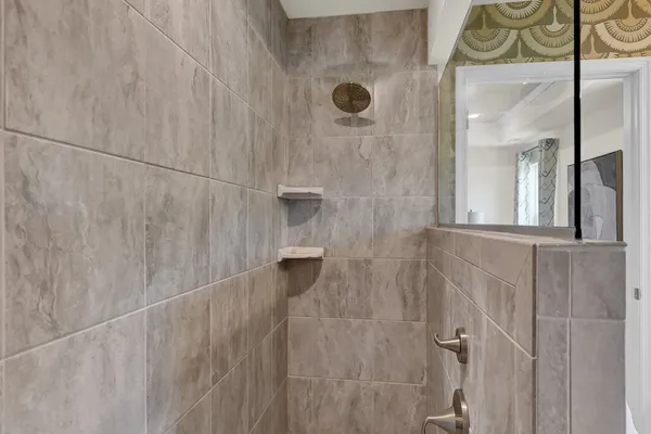 inside the roman style owners baths walk in shower