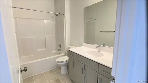 Bathroom featuring oversized vanity and mirror