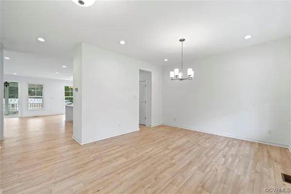 Empty room featuring light hardwood floors