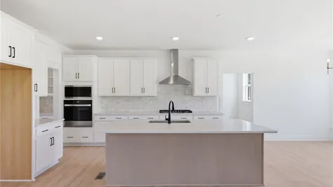 Kitchen - Photos are representative examples of a completed home; actual selections will vary