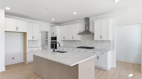 Kitchen -Photos are representative examples of a completed home; actual selections will vary