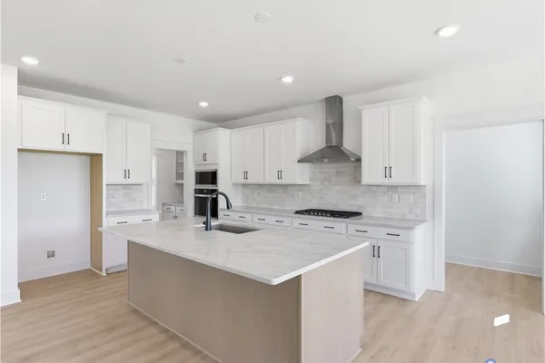 Kitchen -Photos are representative examples of a completed home; actual selections will vary