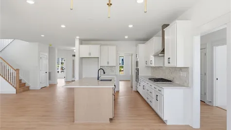 Kitchen -Photos are representative examples of a completed home; actual selections will vary