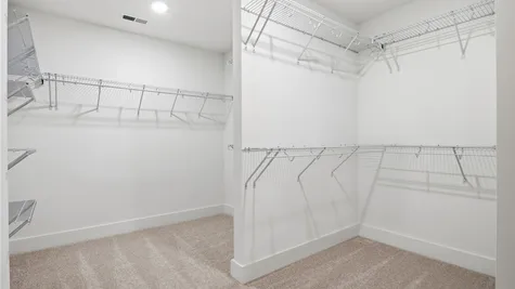 Primary bedroom closet- Photo represents the actual home