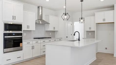 Kitchen - Photo represents actual home