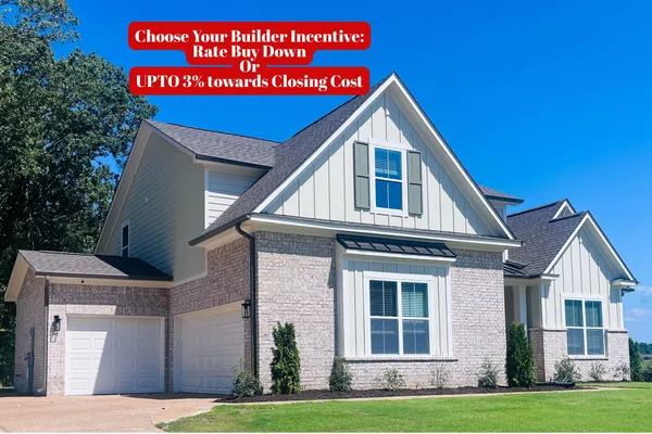 Two-story exterior featuring a brick and board-and-batten facade, multi-gabled roofline, dual-bay garage, and dark-toned shutter accents