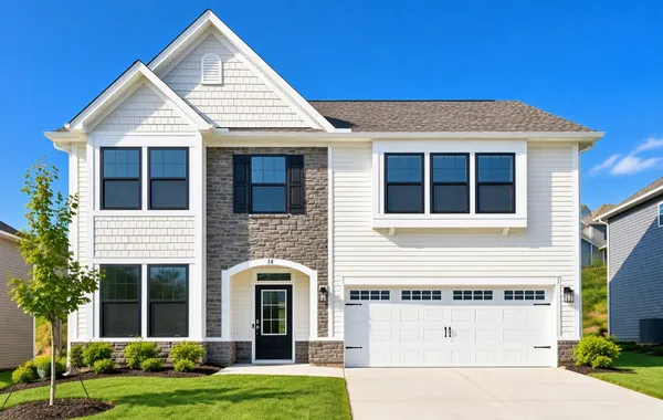 Stone accents and classic siding define this strik
