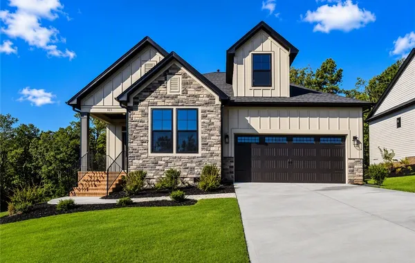 Textured stone veneer and board-and-batten siding