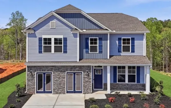 A well-appointed two-story home features a charmin