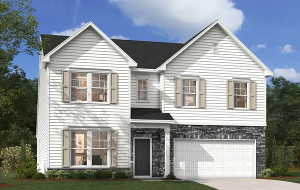 Crisp white siding contrasts with stone accents on