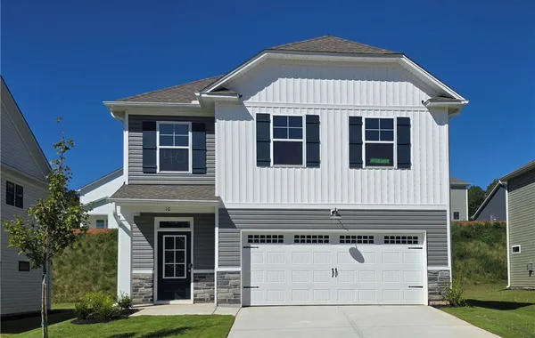 Colorful siding pairs with stone veneer accents on