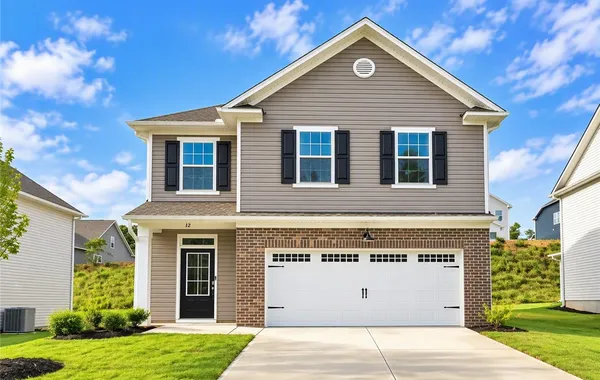 A classic two-story exterior pairs traditional bri