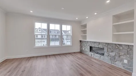 Family Room with Upgraded Fireplace and Build-In Shelving
